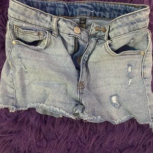 Ripped light jean shorts.